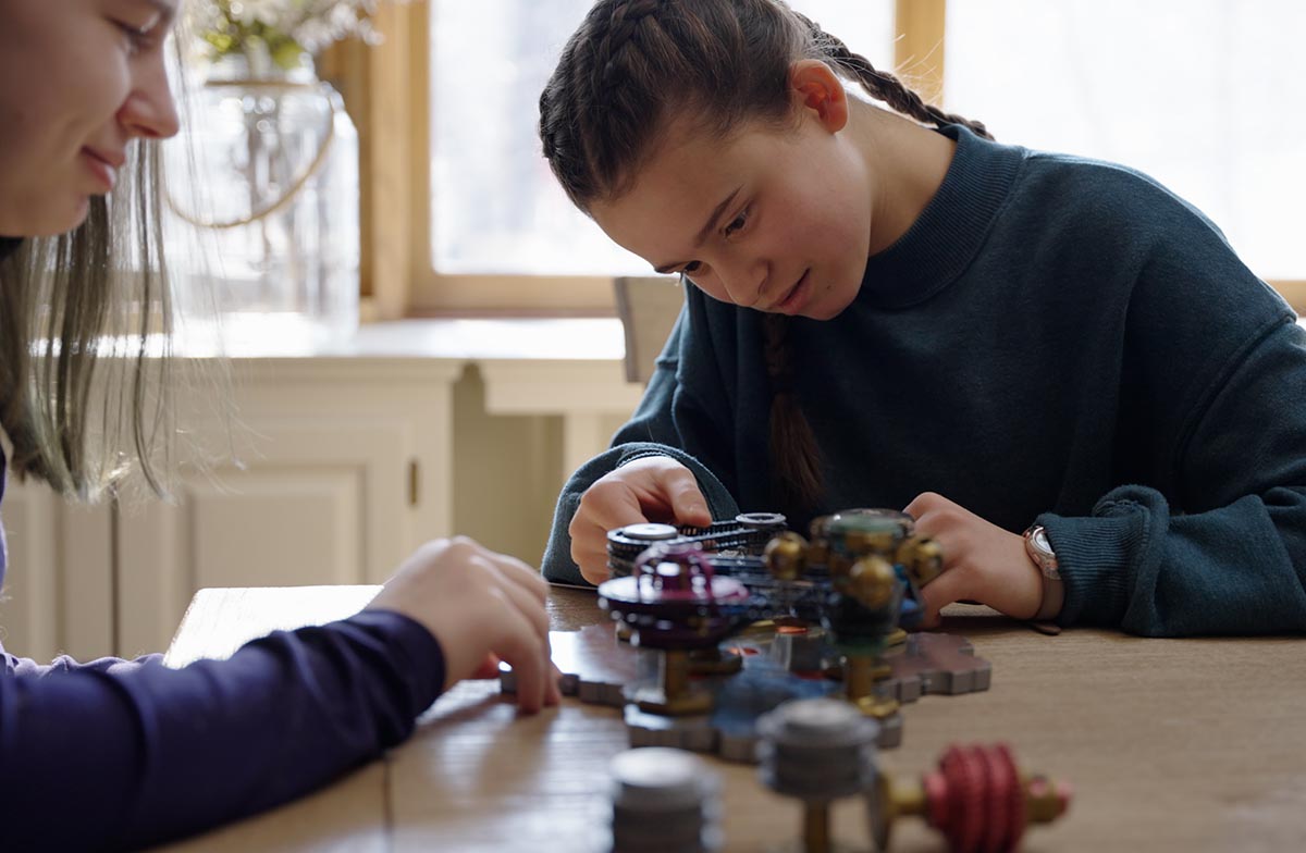 Two girls building spintronic circuits