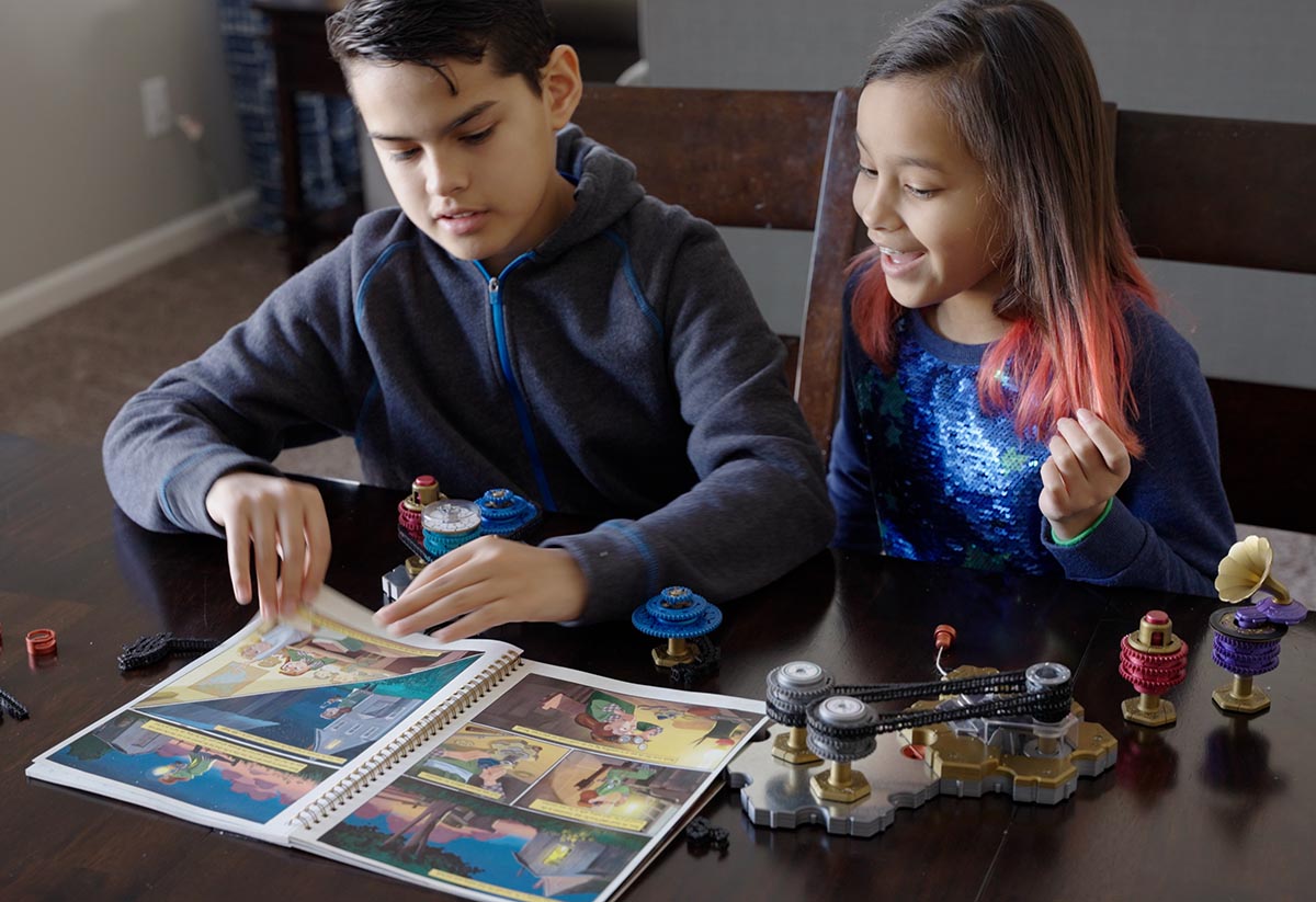 A young boy and girl building spintronic circuits